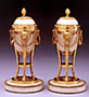 A pair of Louis XVI marble and gilt bronze cassolettes